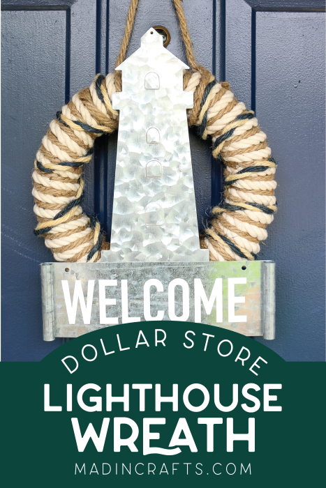 dollar store lighthouse wreath on a navy door