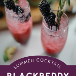 two glasses of blackberry gin and tonic garnished with blackberries and rosemary