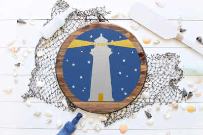 vinyl lighthouse design on a wooden circle sign styled on a fishing net