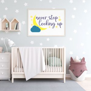 nursery with never stop looking up wall art