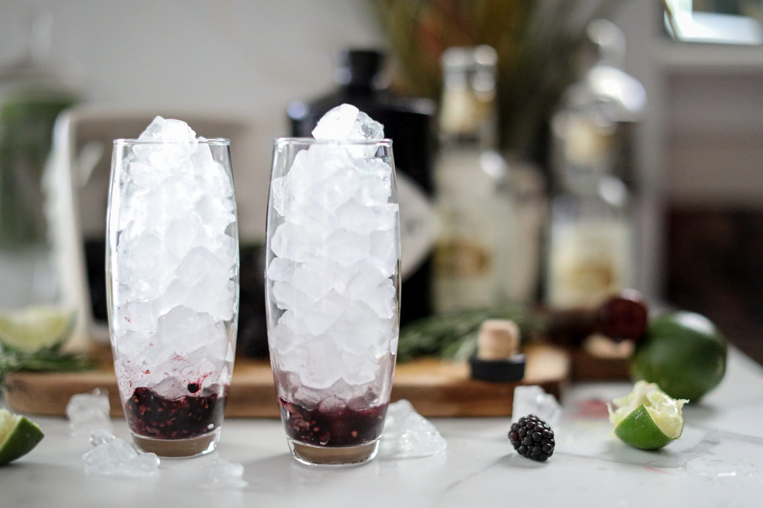 Two cocktail glasses filled with ice