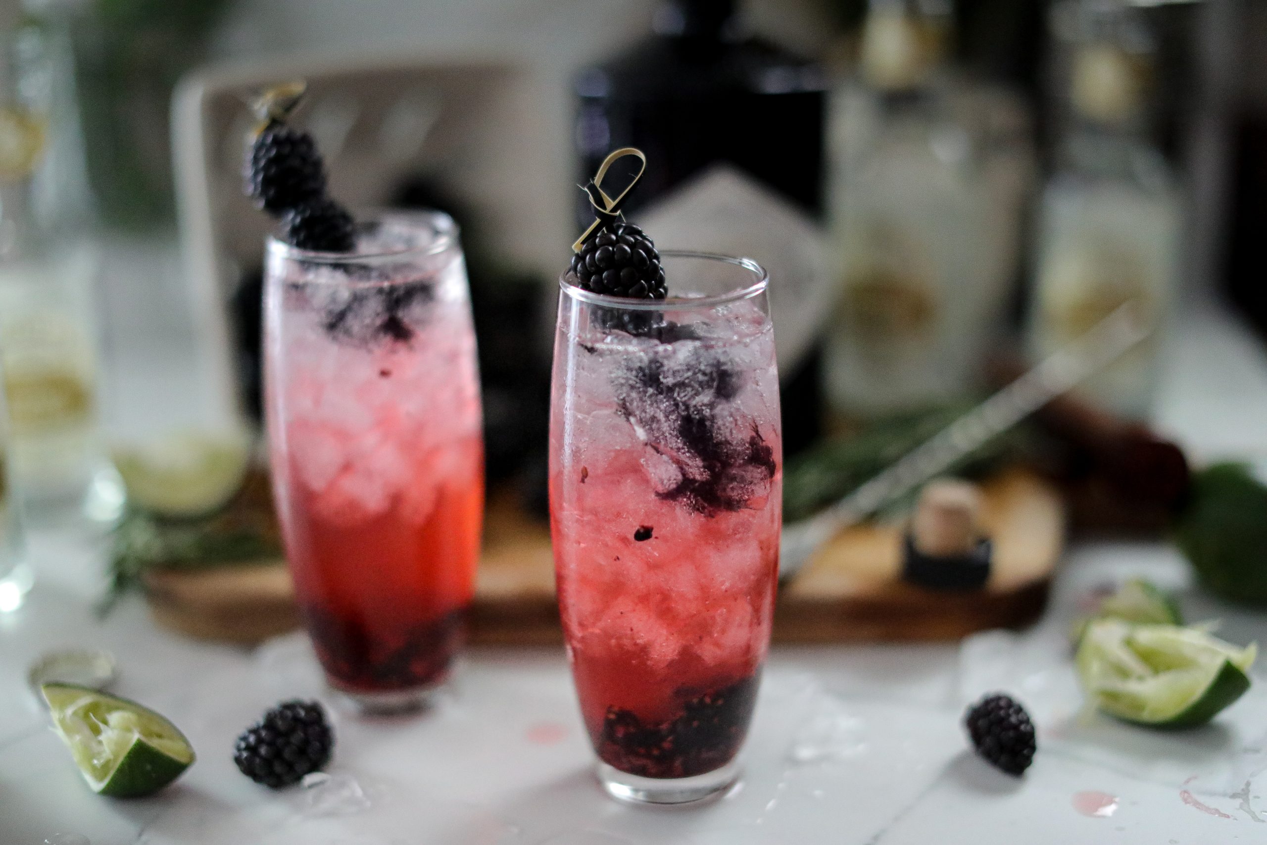 blackberry gin and tonics garnished with fresh berries