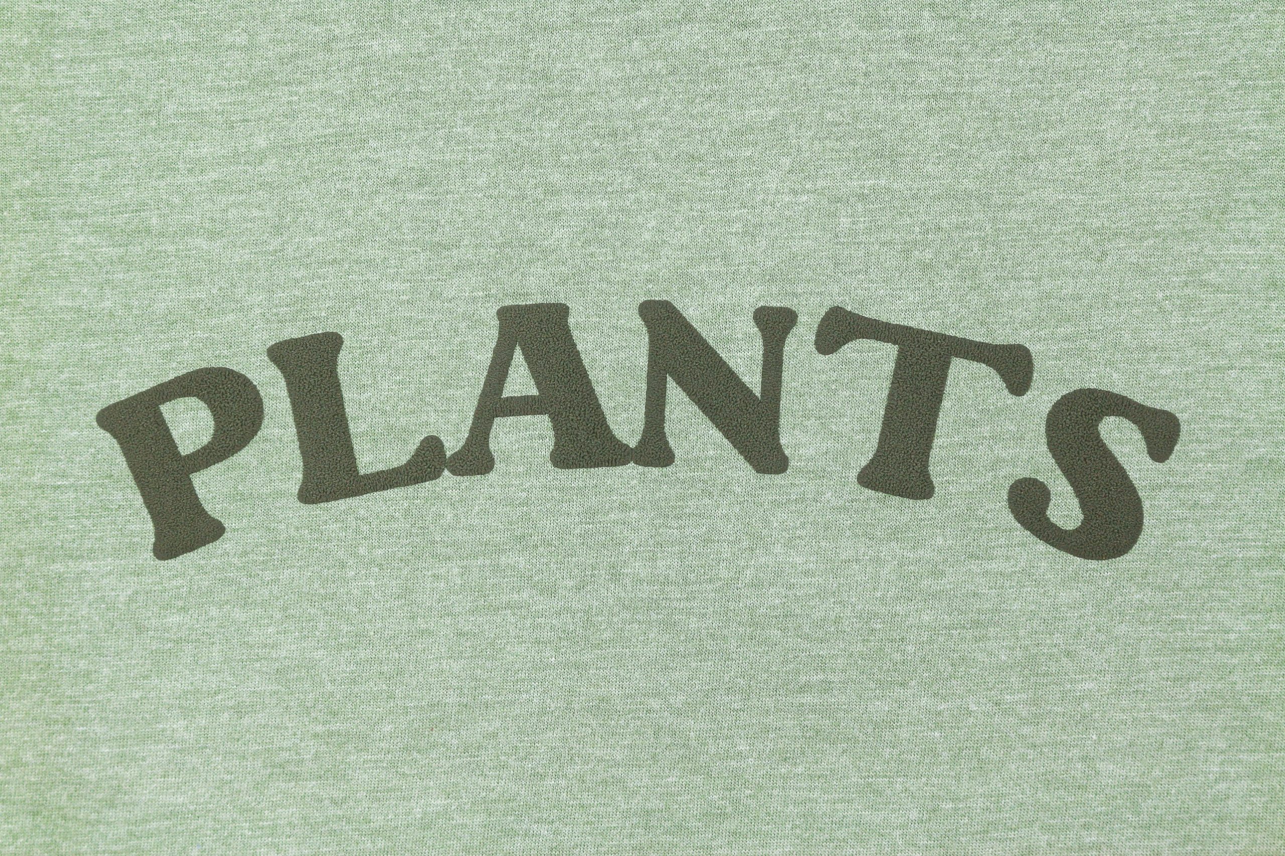 Green tshirt that reads "PLANTS" in Puff Vinyl