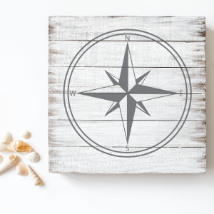 wooden plank sign with nautical compass design