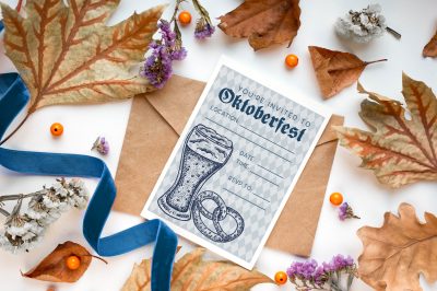 Oktoberfest Party invitation near fall decorations
