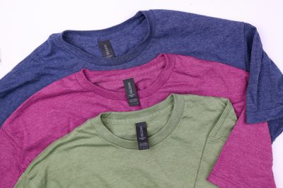 green, blue, and berry colored t-shirts