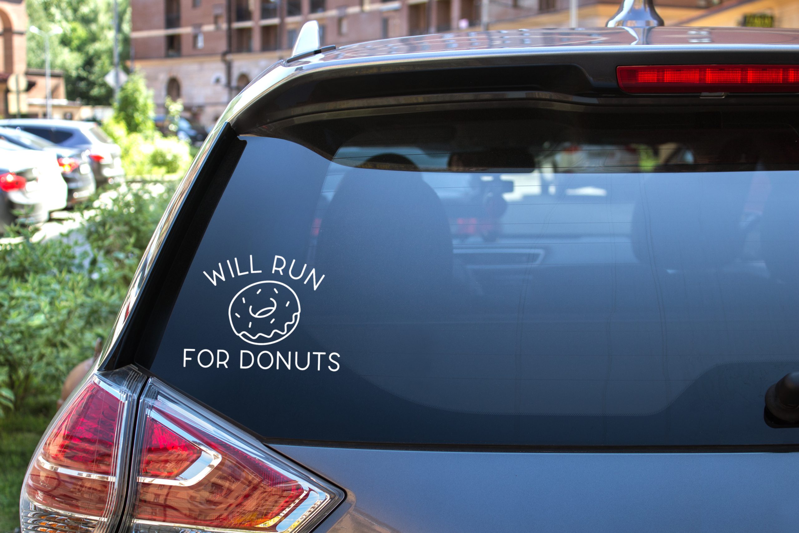 rear window of SUV with Will Run for Donuts Vinyl Sticker