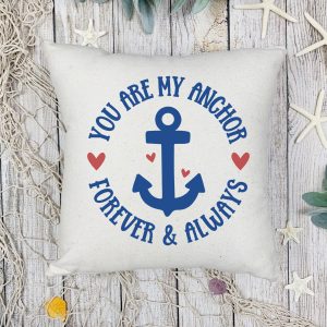 white throw pillow decorated with an anchor svg