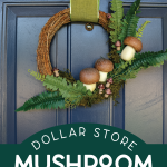 Rustic wreath decorated with mushrooms on a blue door