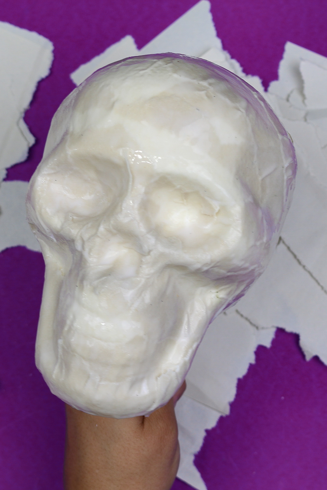 close up of dollar store skull covered with paper mache