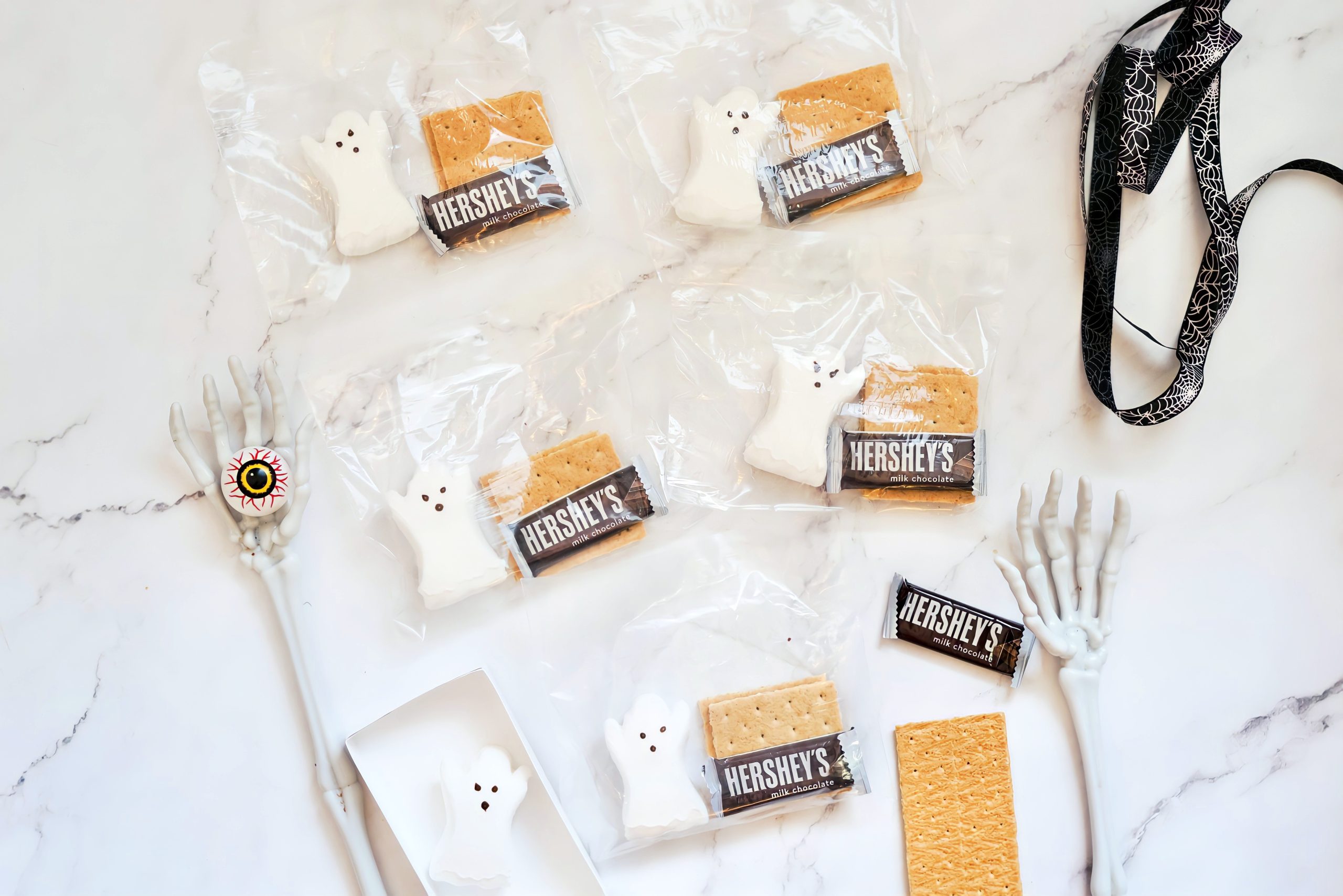 clear plastic bags filled with ghost marshmallow Peeps, graham crackers and Hershey's chocolate
