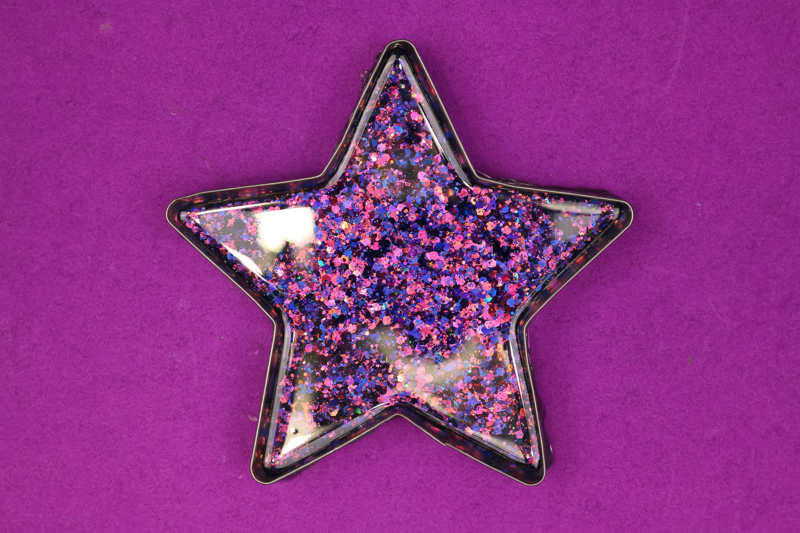 dollar store metal star filled with glitter resin