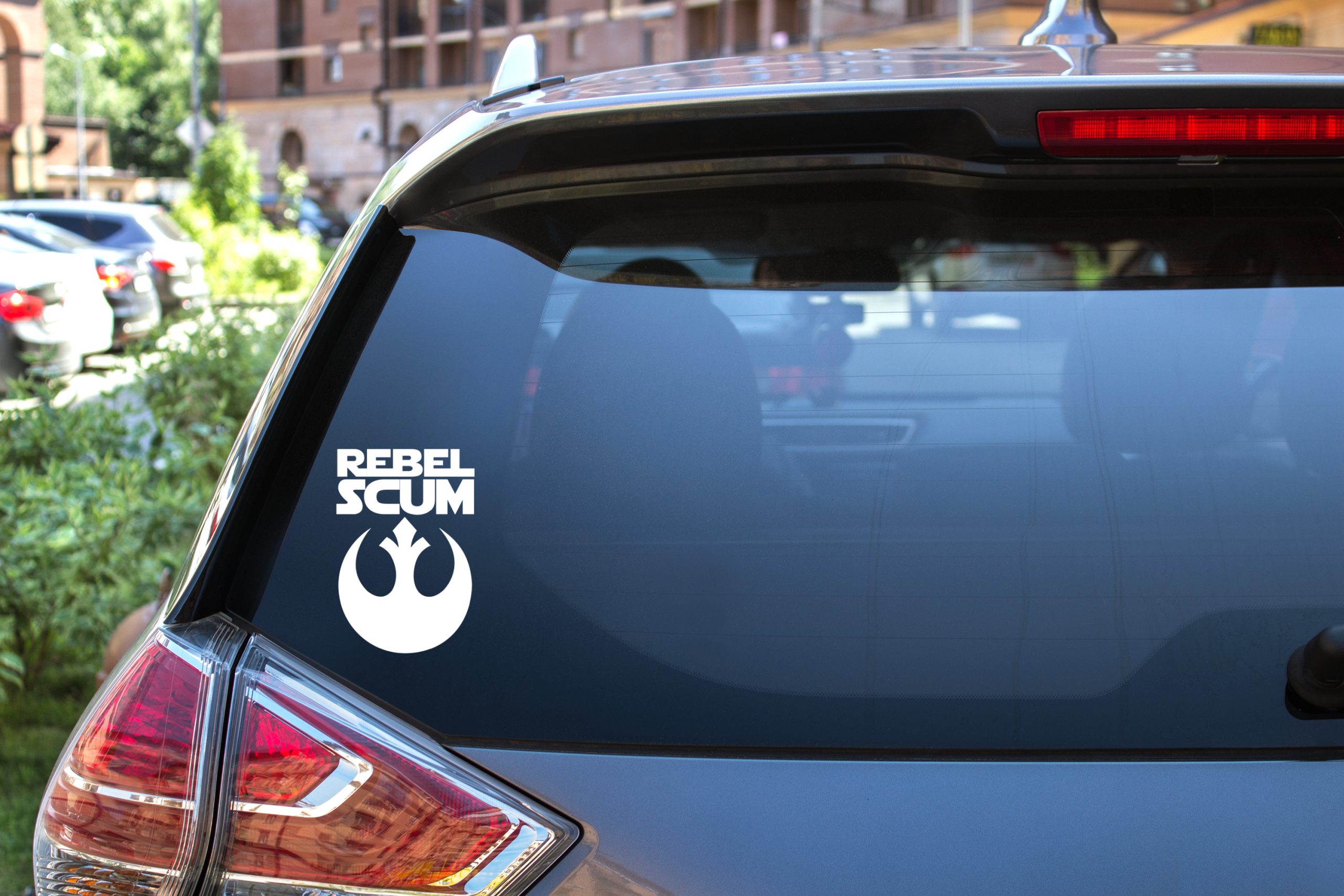 Rebel Scum decal on the rear window of a SUV