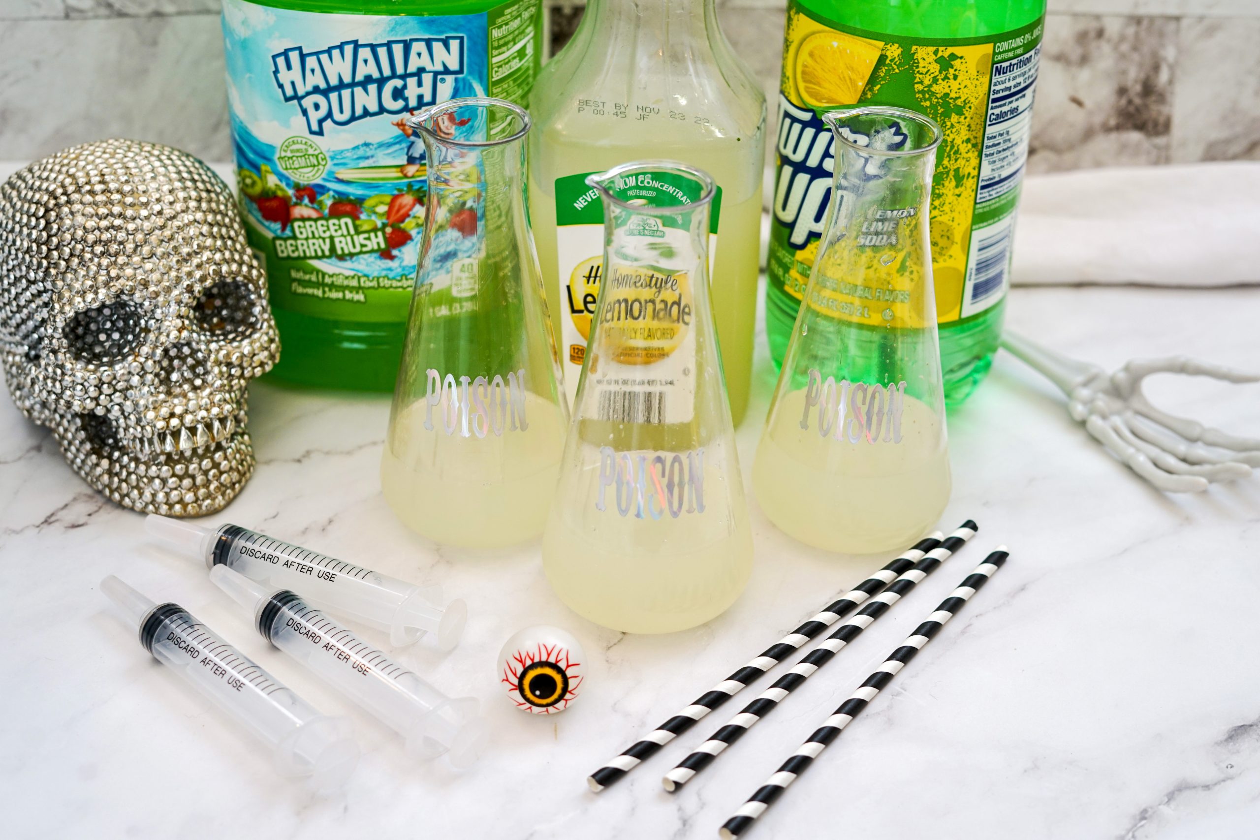 dollar store plastic vials partially filled with lemonade