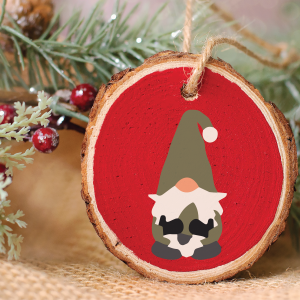 wood slice christmas ornament with a gnome design