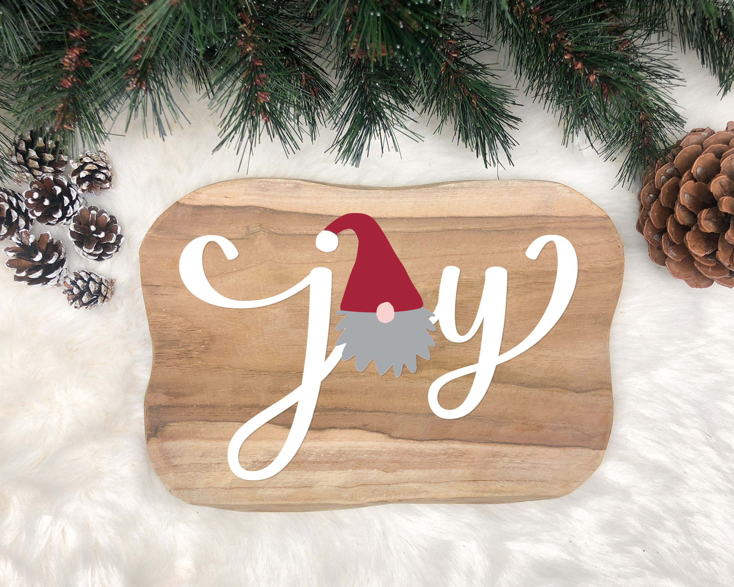 Gnome Joy SVG on a wooden cutting board