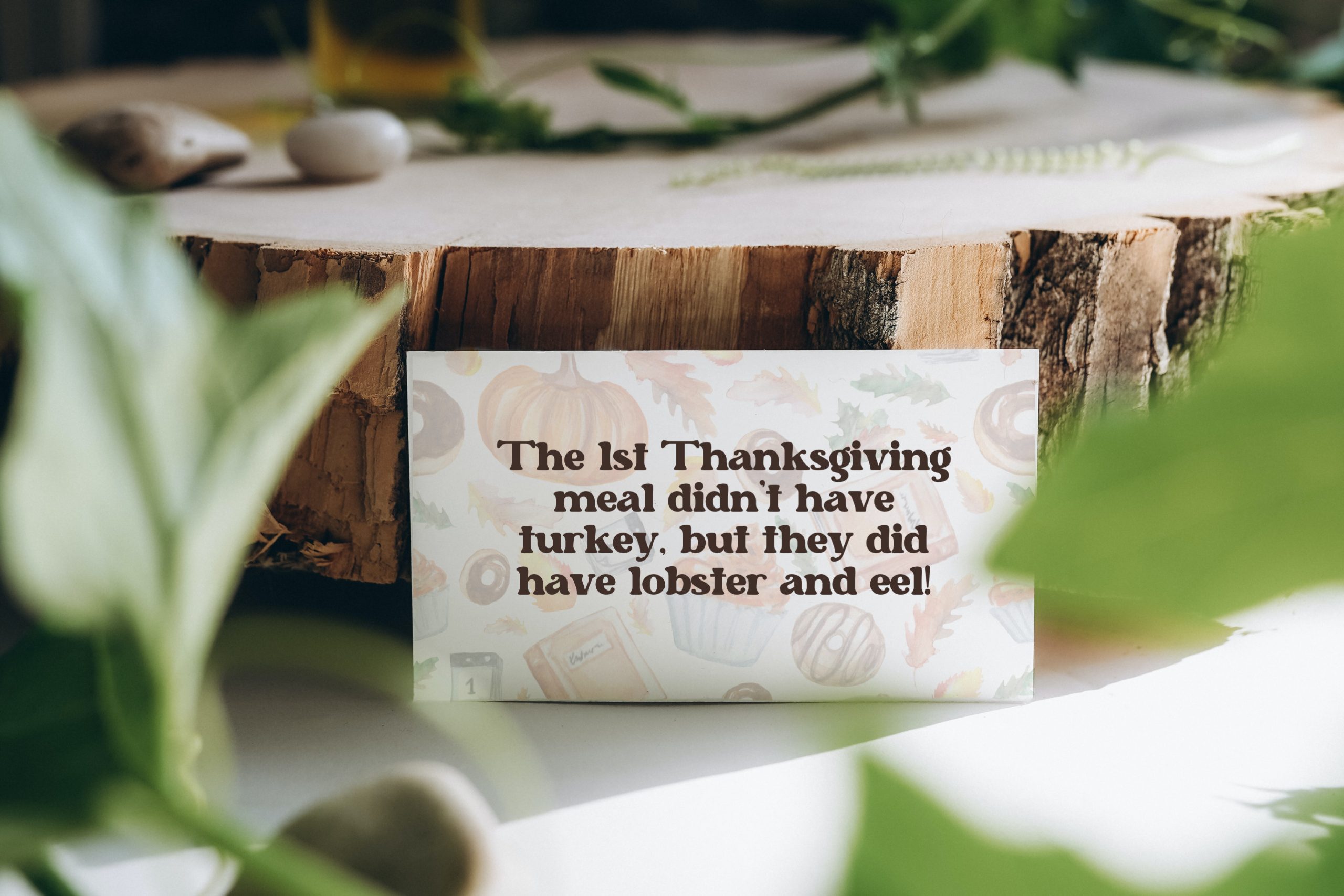 Thanksgiving trivia card leaned up on table decorations