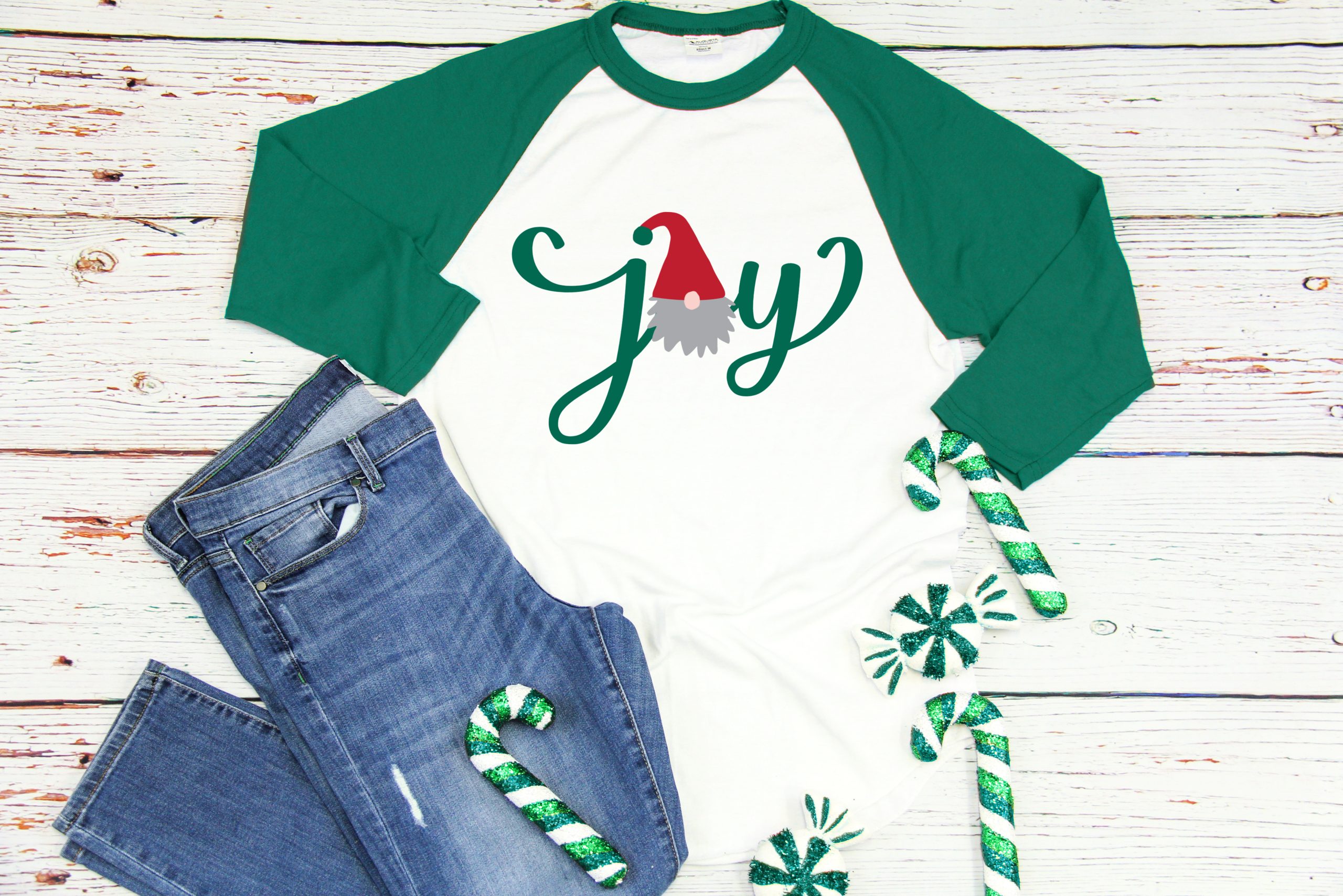 Gnome Joy SVG on a green and white baseball shirt near Christmas Decorations