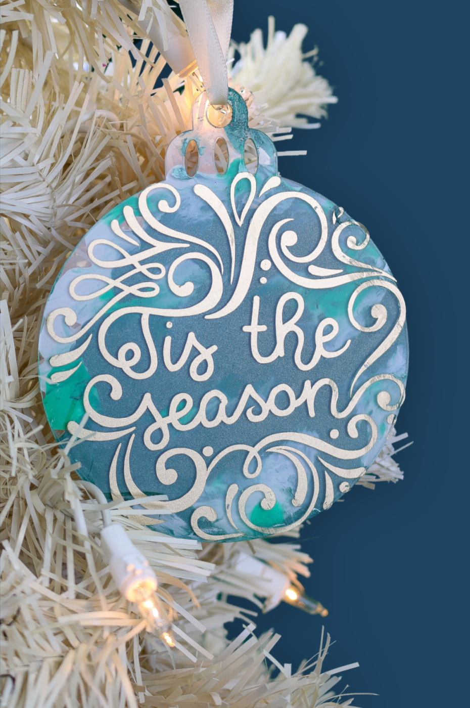 Tis the Season disc ornament on a white Christmas tree