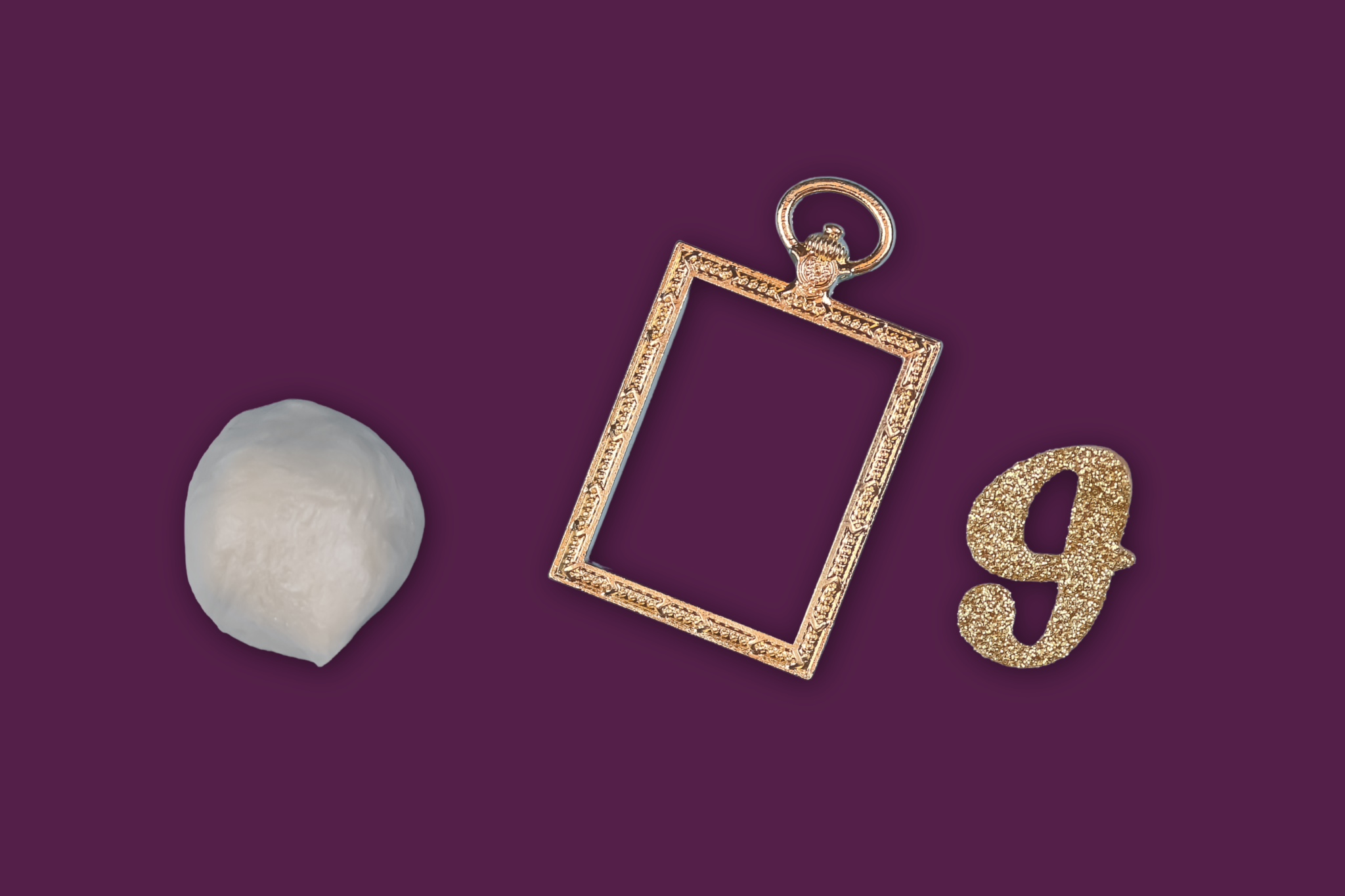 flat lay of jewelry clay, a open bezel, and an initial sticker