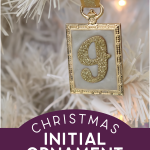 a letter J initial ornament hanging on a white tree