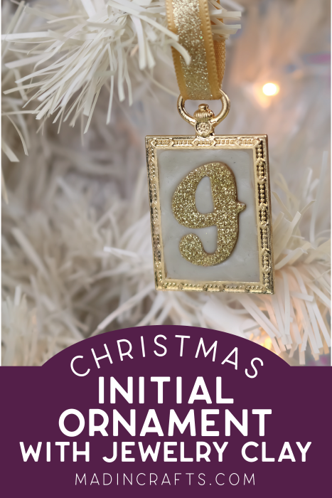 a letter J initial ornament hanging on a white tree