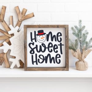 Snowman Home Sweet Home sign on a mantel