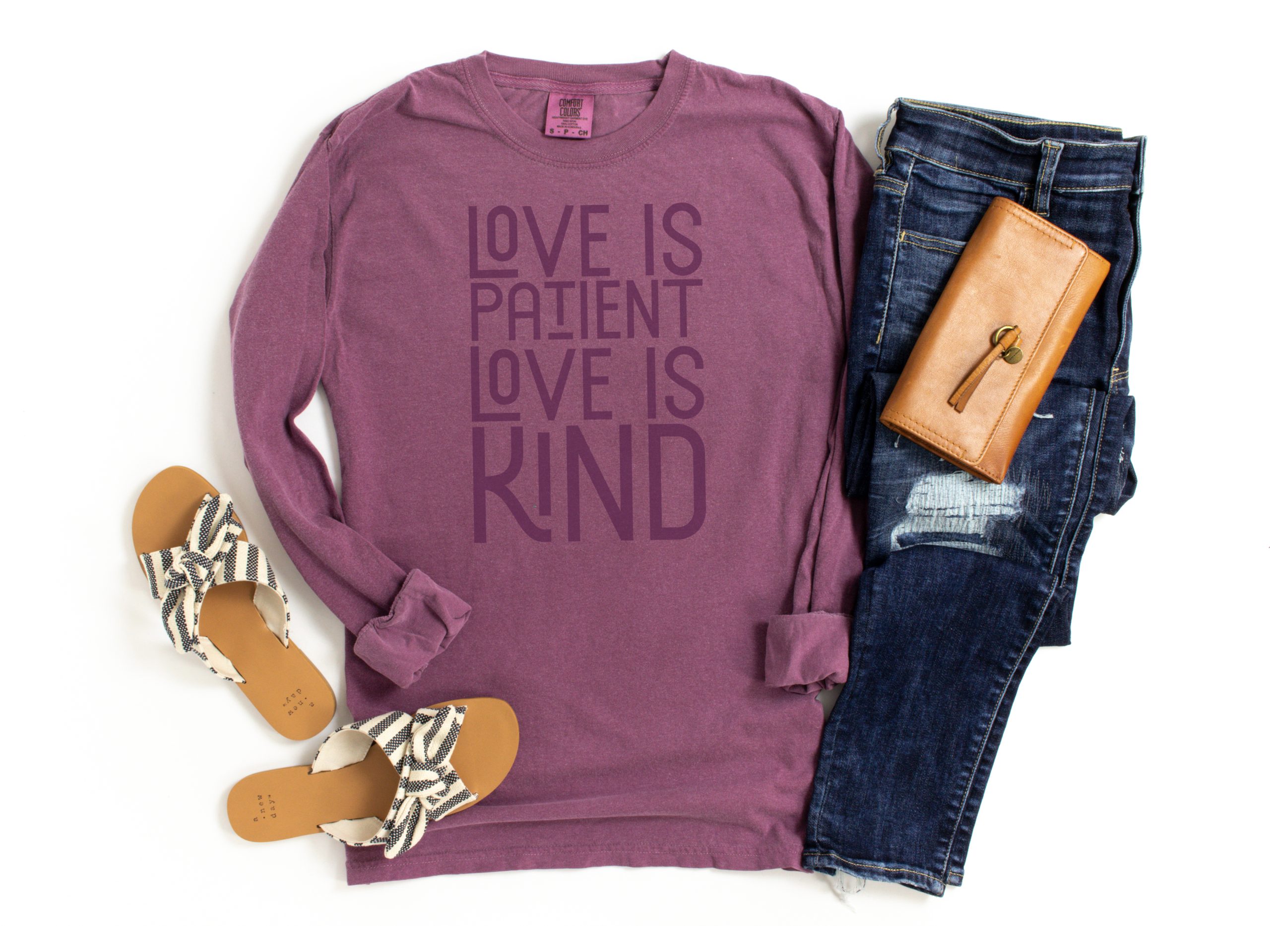 purple shirt that reads Love is Patient Love is Kind