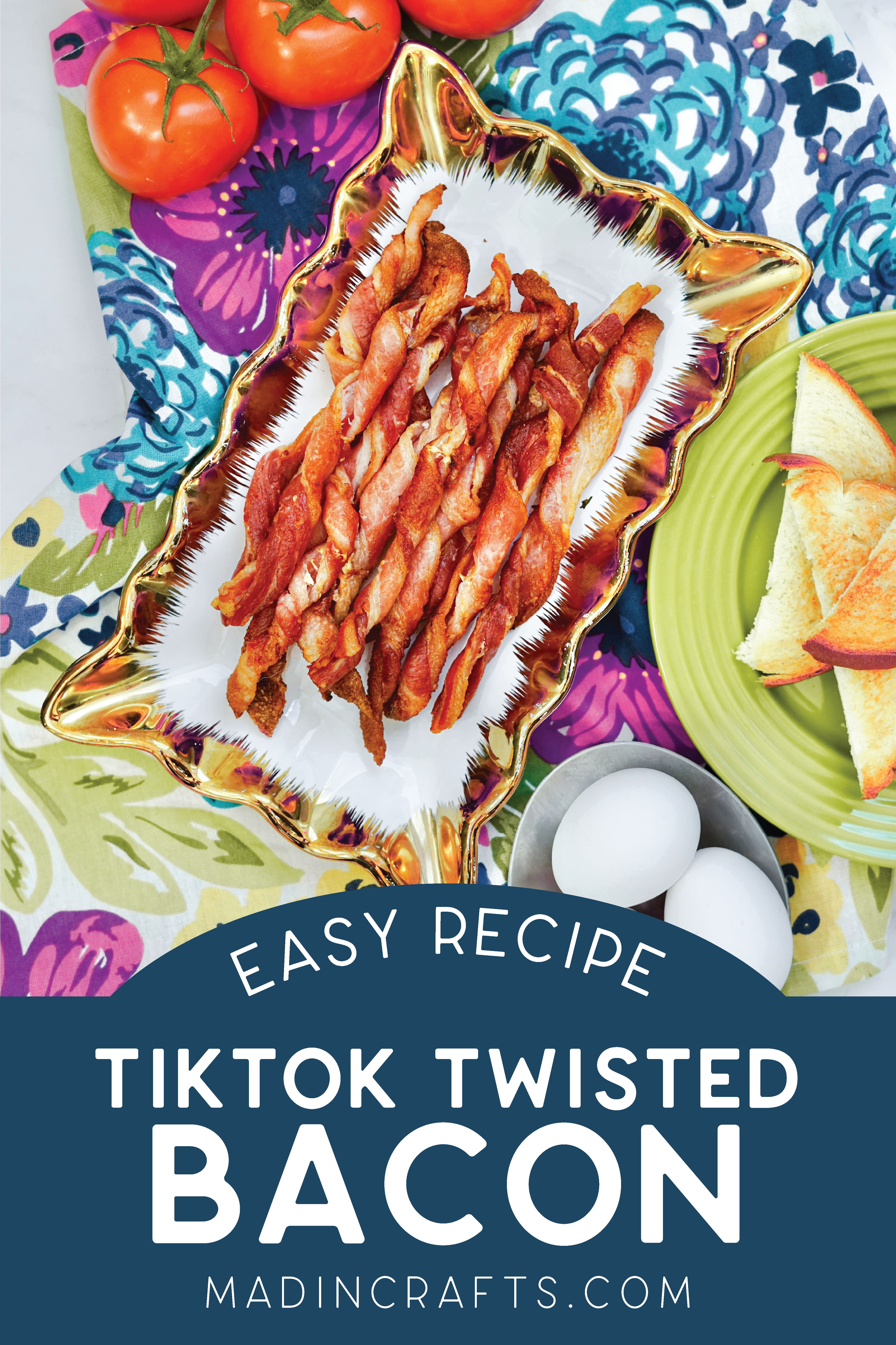 Platter of air fried bacon twists on a colorful tablecloth near tomatoes and eggs.Platter of air fried bacon twists on a colorful tablecloth near tomatoes toast, and eggs.