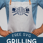 Man wearing a blue buttondown shirt an a white apron with a grill themed monogram design