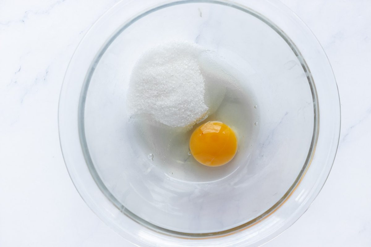 Sugar and eggs in a glass bowl
