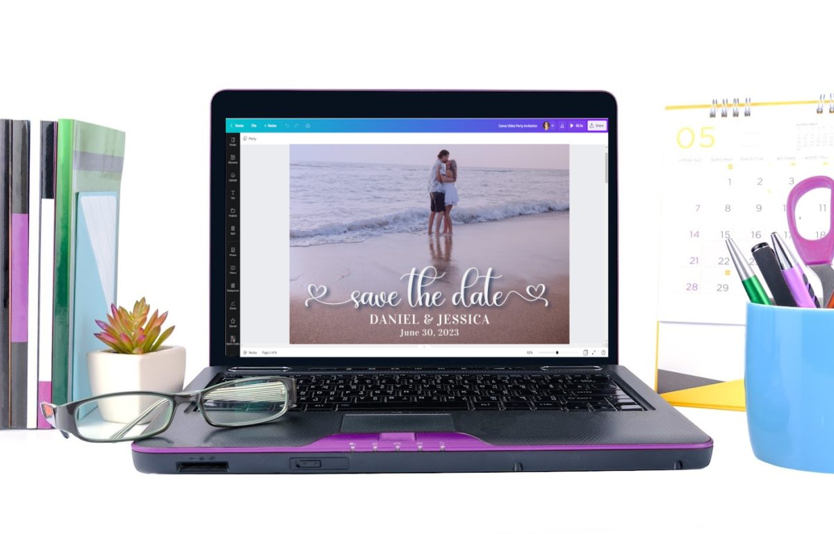 Small laptop on a desk. The laptop screen shows Canva editing the save the date card.