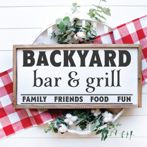 Rustic wood framed sign that reads Backyard Bar & Grill.