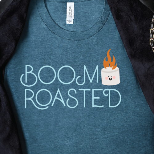 Close up of a blue tee with Boom Roasted design