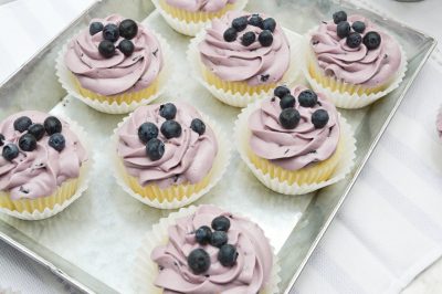Closeup of a tray of blueberry cupcakes
