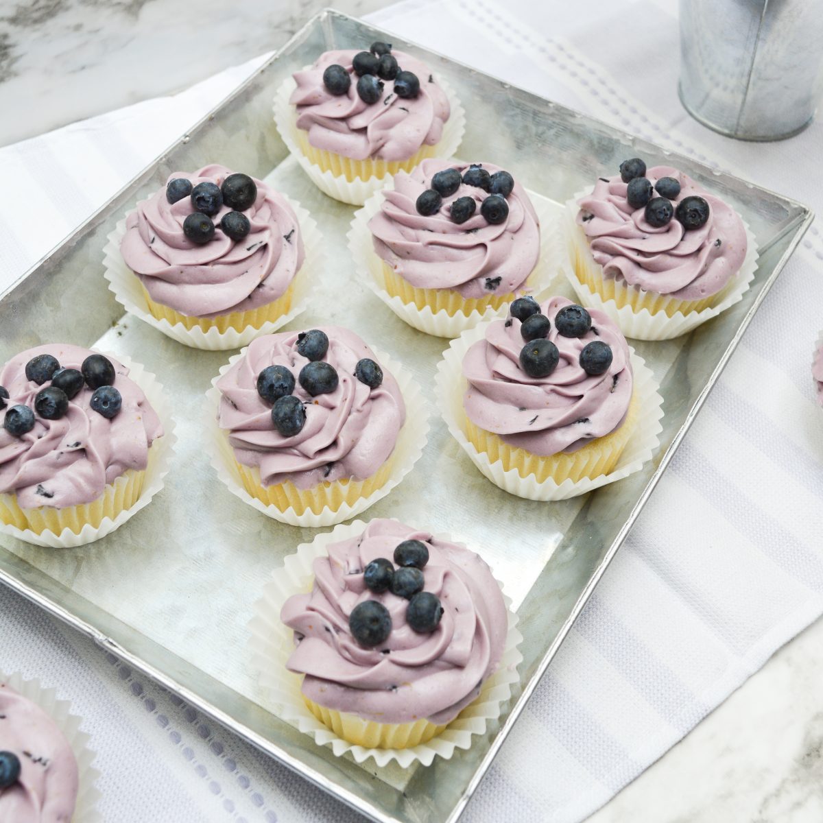 Closeup of a tray of blueberry cupcakes