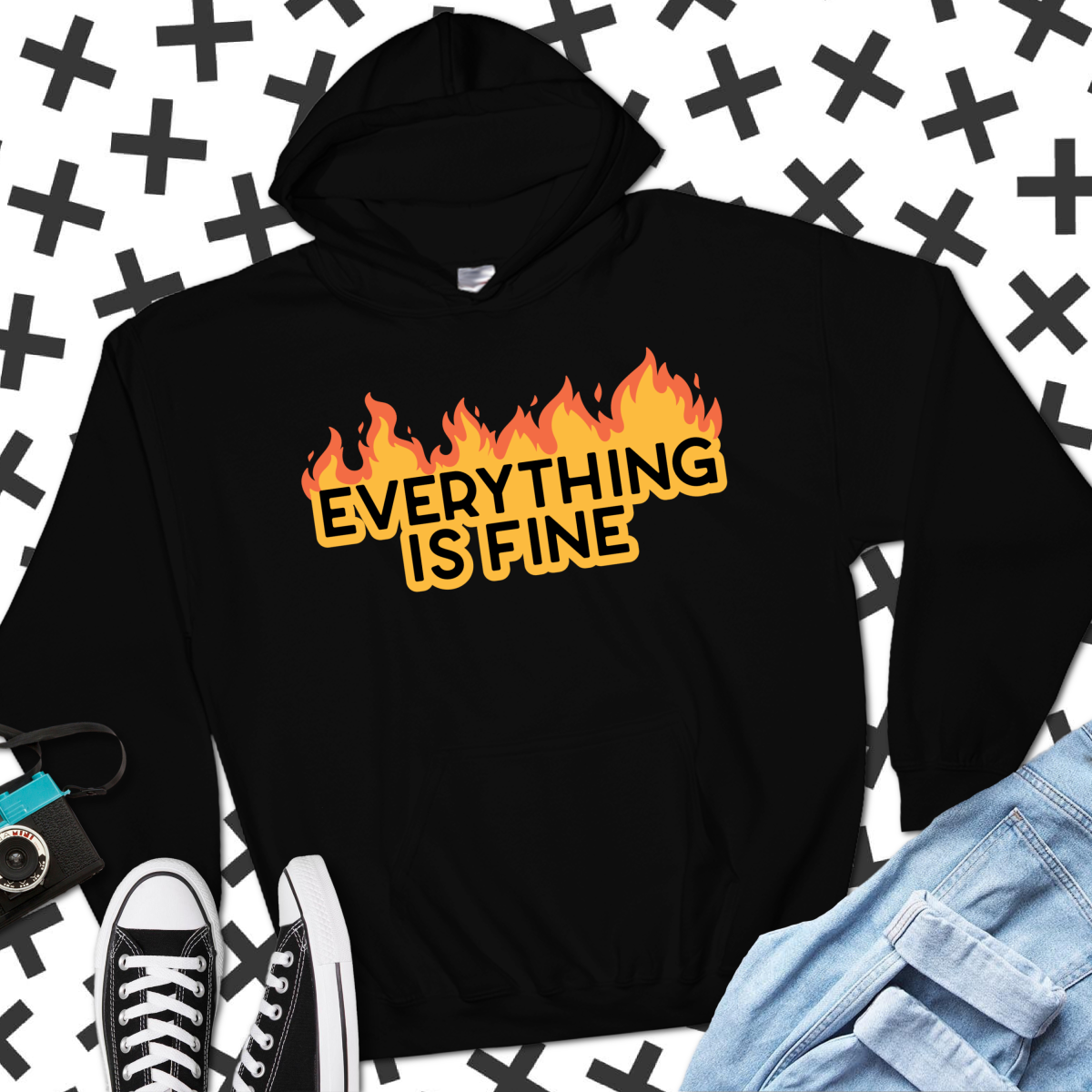 jeans and Converse near a black sweatshirt with a Everything Is Fine design in vinyl