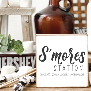 Smores Station sign near rustic decor