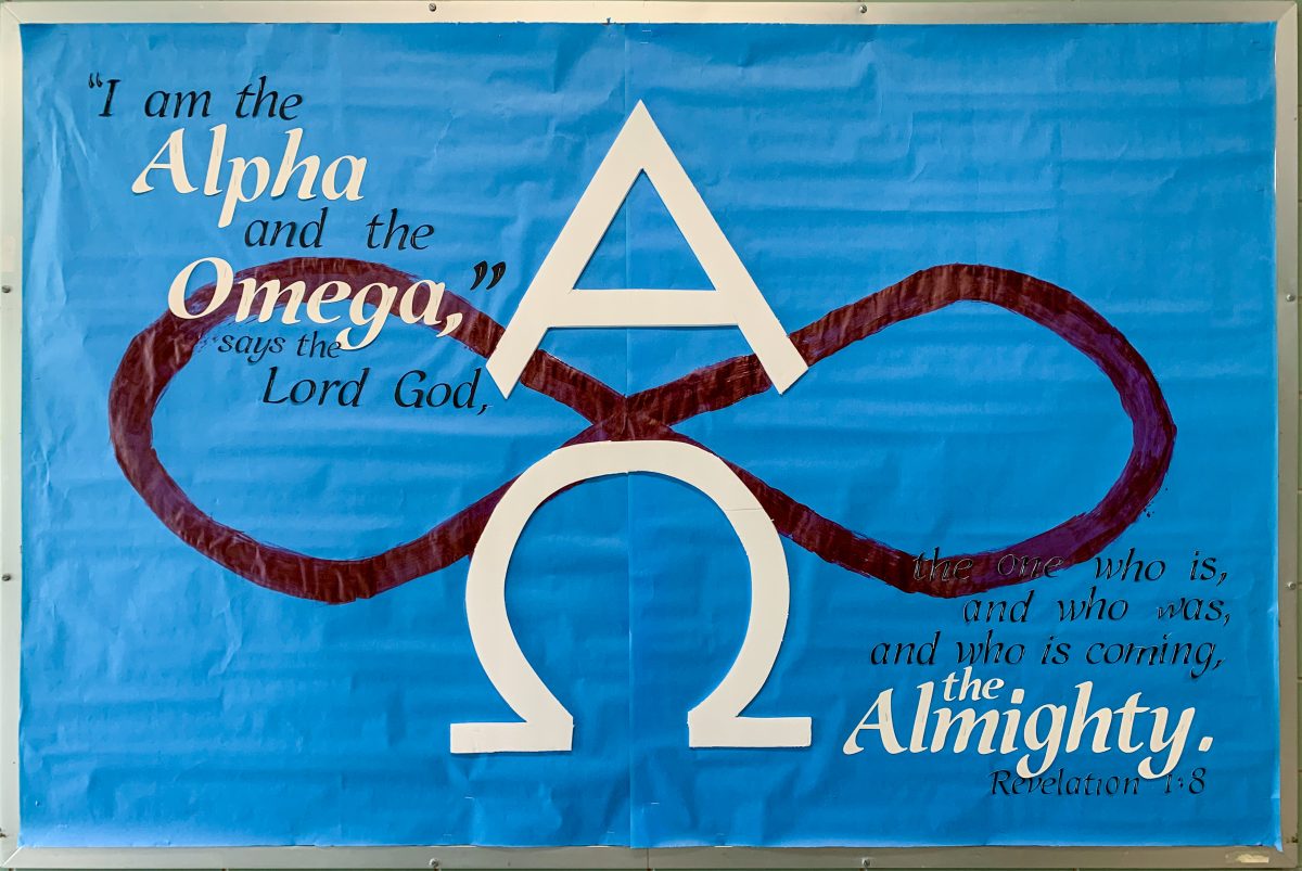 Blue bulletin board with Alpha and Omega design