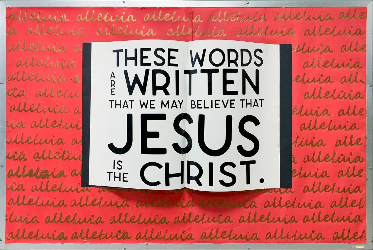 Red bulletin board with an open Bible design