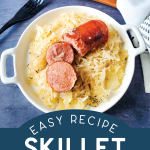 serving dish with sauerkraut and sausage near a cast iron skillet