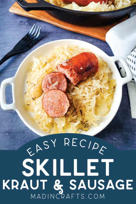 serving dish with sauerkraut and sausage near a cast iron skillet