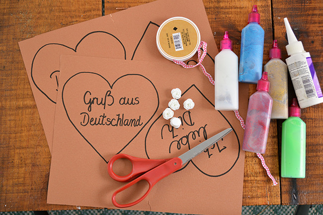 Flat lay of the supplies needed to make DIY paper German hearts
