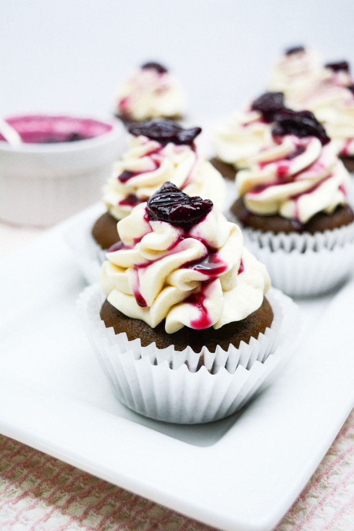 homemade black forest cupcakes on a white plate