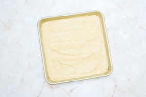 square pan covered with pumpkin cream cheese mixture