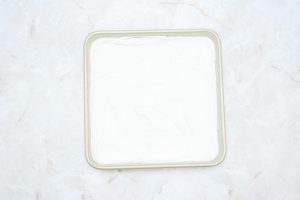 square pan layered with whipped cream