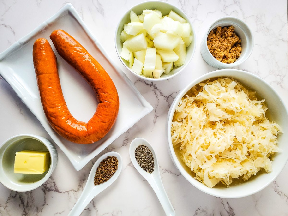 flat lay of ingredients for sausage and sauerkraut
