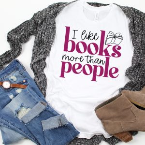 Cardigan over a white shirt that says I like books more than people