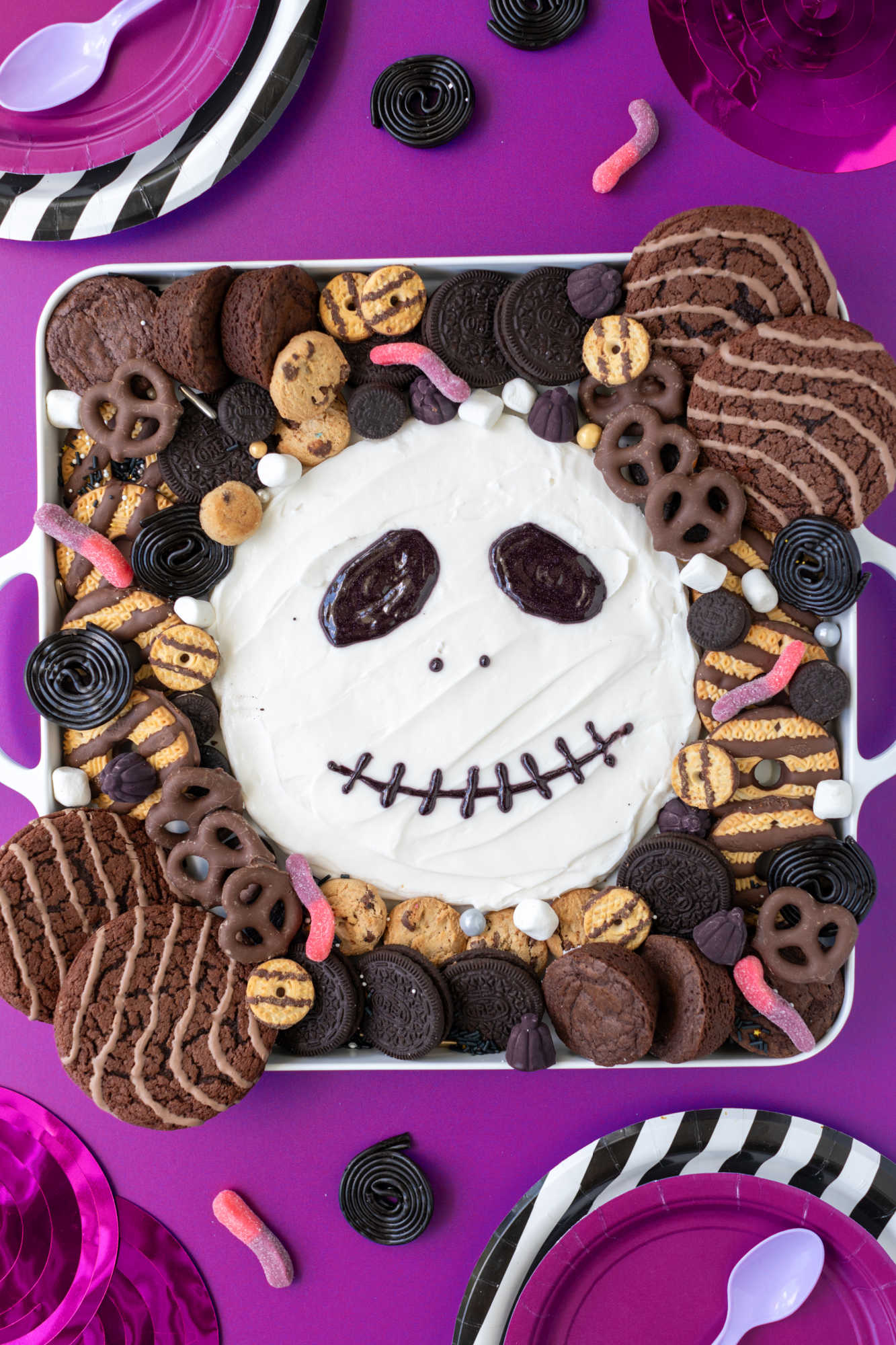 Finished Jack Skellington frosting board near party supplies