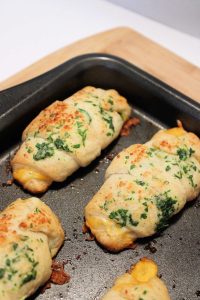 baked cheesy jalapeno crescent rolls on a baking sheet